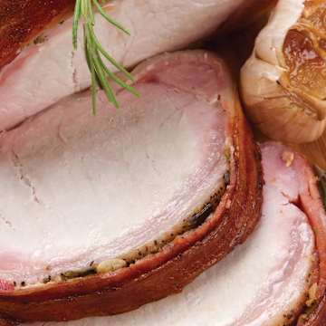 Bacon-Wrapped Pork Roast with Sweet Potato Bourbon Mash