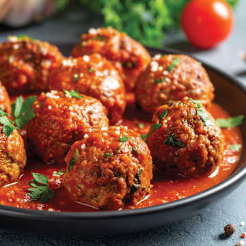 Mozzarella Stuffed Meatballs in Sunday Sauce