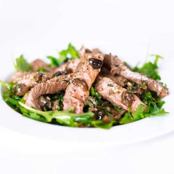 Steak with an Olive Marinade