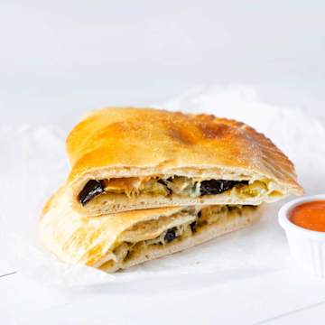 Aubergine & Pesto Calzones With Roasted Cherry Tomato Sauce