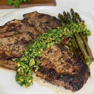 Olive Rosemary Compound Butter Steaks with Asparagus and Orange Zest Gremolata