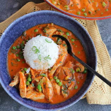 Chicken in paprika sauce with mushrooms and peas