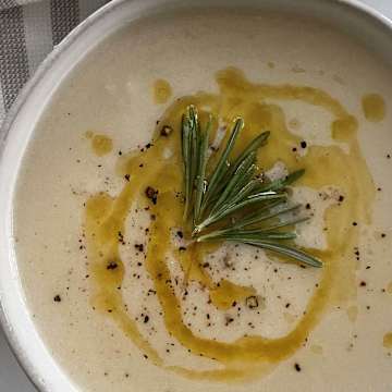 Creamy Cauliflower Soup with Rosemary Infused Olive Oil Drizzle