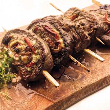 Smoked Flank Steak Pinwheels with Prosciutto, Peppers & Walnut Pesto