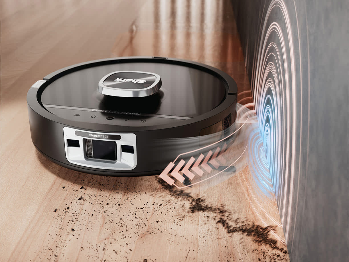 A Shark 2 in 1 robot vacuum cleaner cleaning hard floor