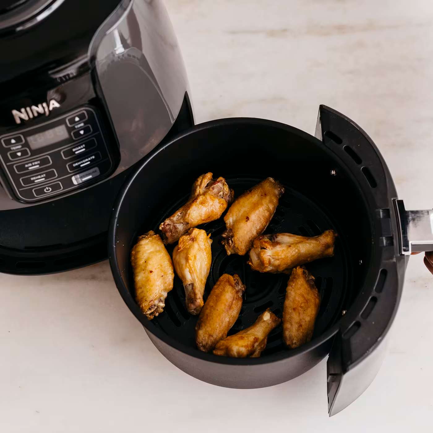 Air fryer with wings