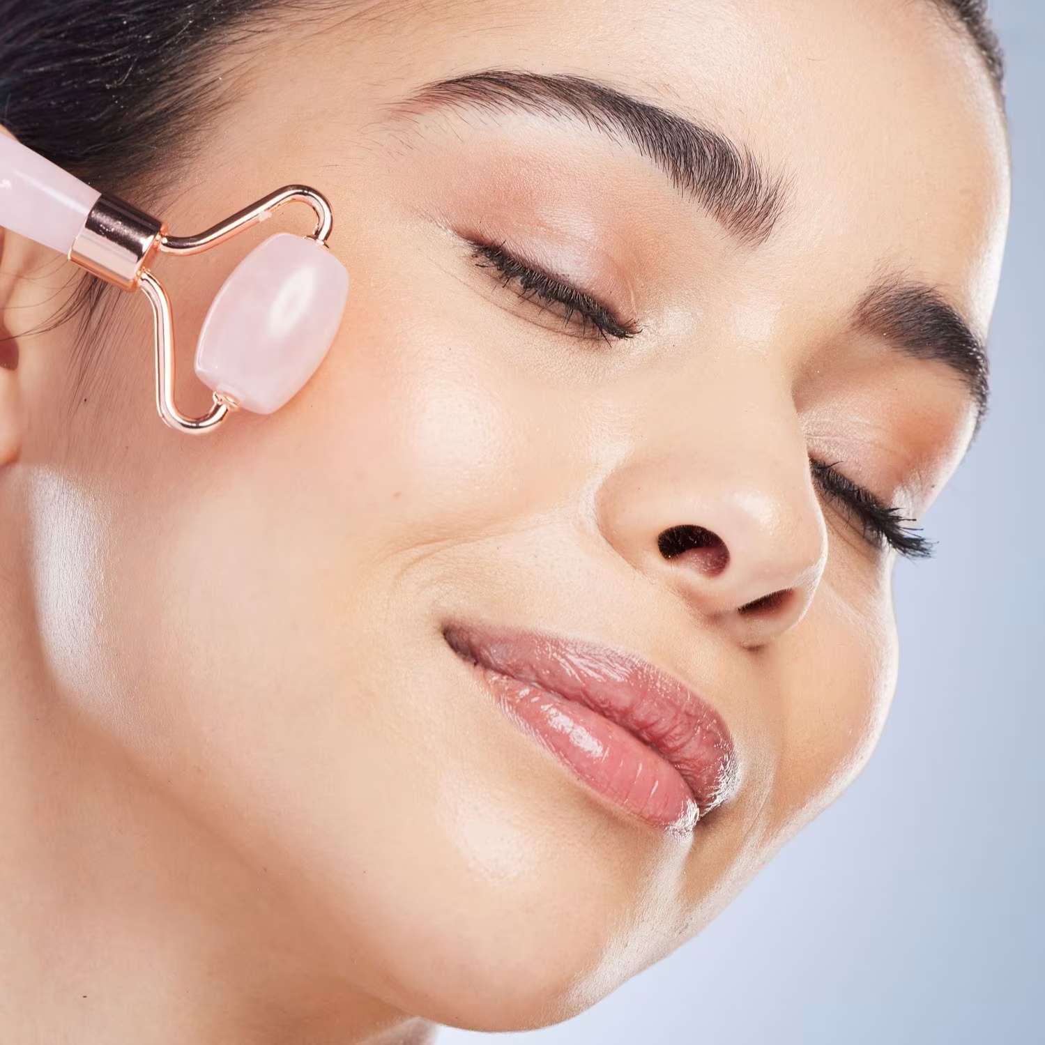 Woman rolling face with roller