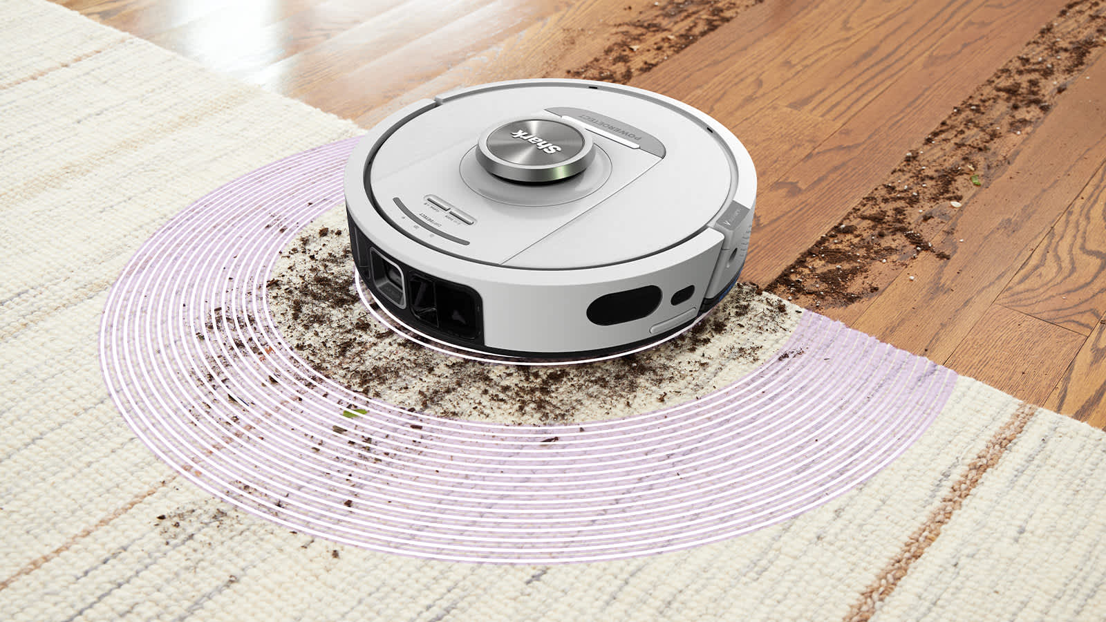 Robot aspirateur blanc ramassant la poussi&egrave;re sur le sol.