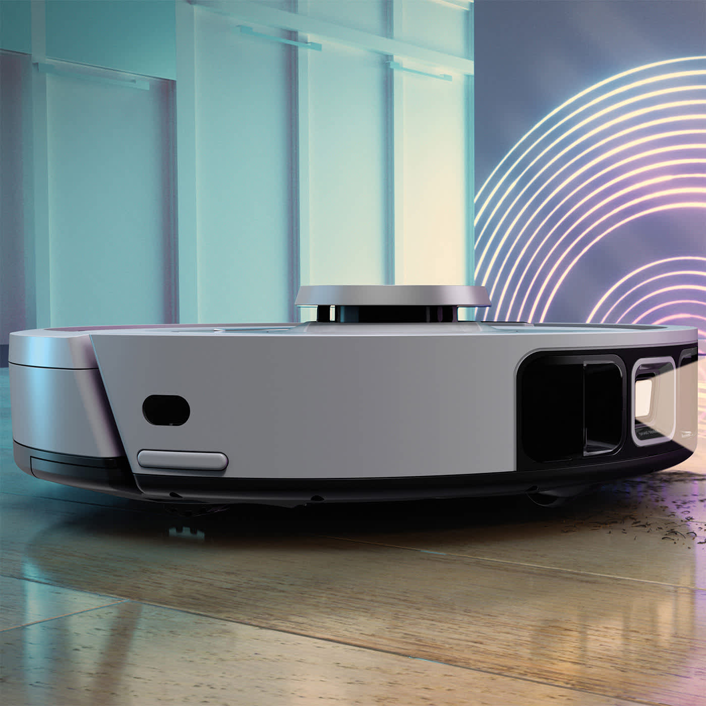 Aspirateur robot pos&eacute; sur une table, avec une lumi&egrave;re &eacute;manant de l&rsquo;avant.
