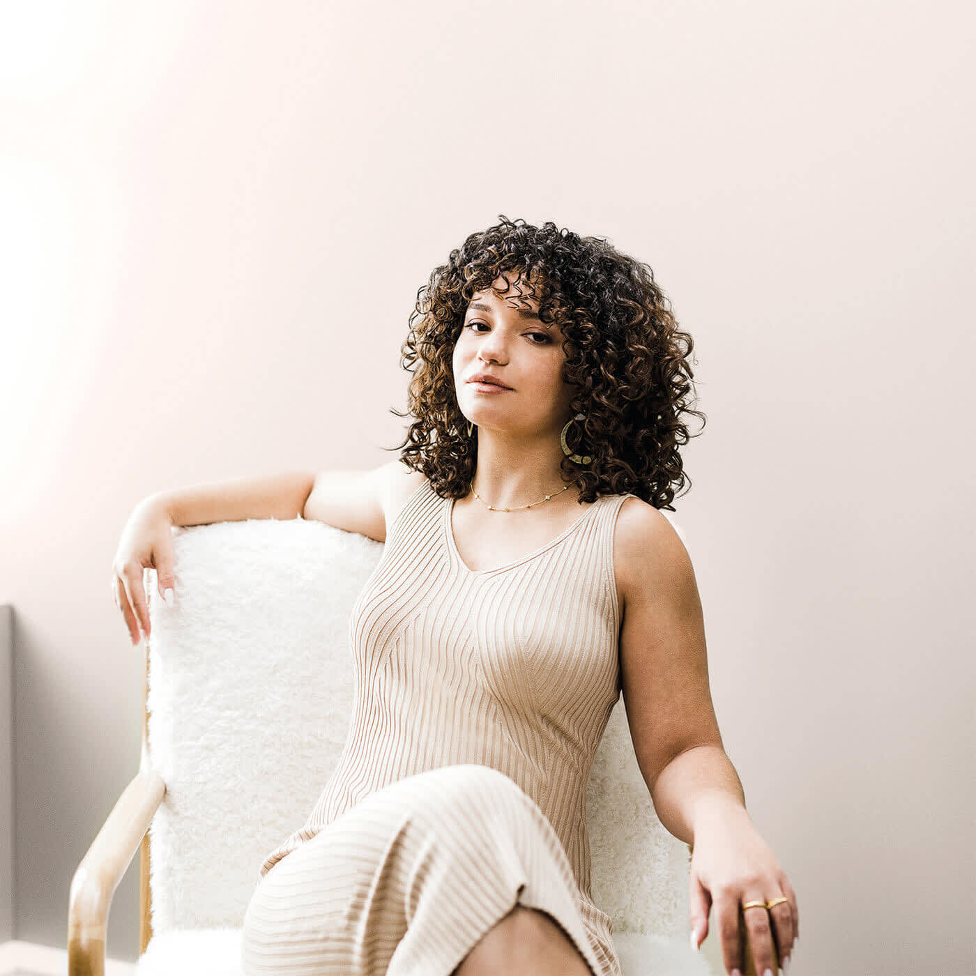 Curly hair woman on chair