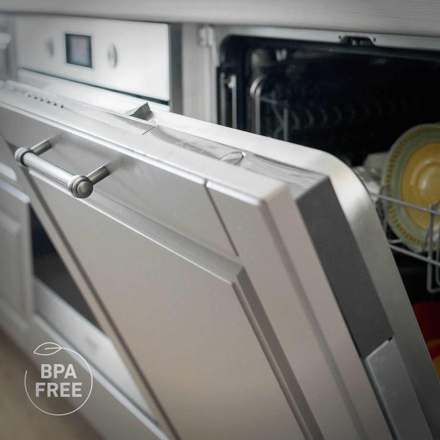 Ninja CREAMi components placed inside a dishwasher for easy cleaning, highlighting the BPA-free label.