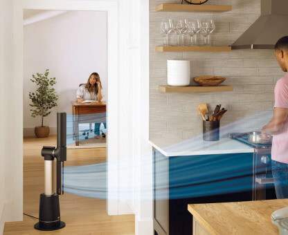 Image of man cooking in the kitchen with the Shark Turbo Blade fan