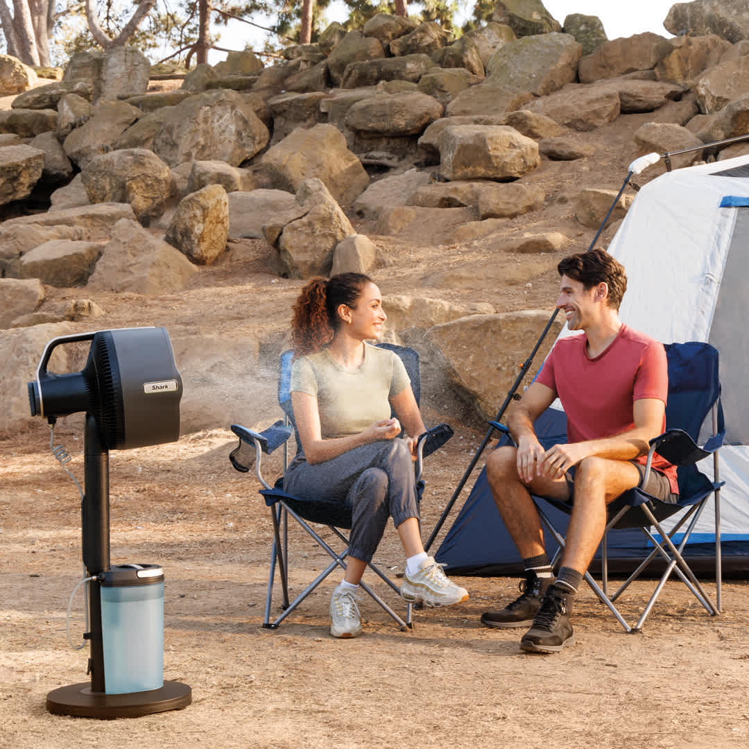 Image of man and woman camping with the Shark FlexBreeze Pro